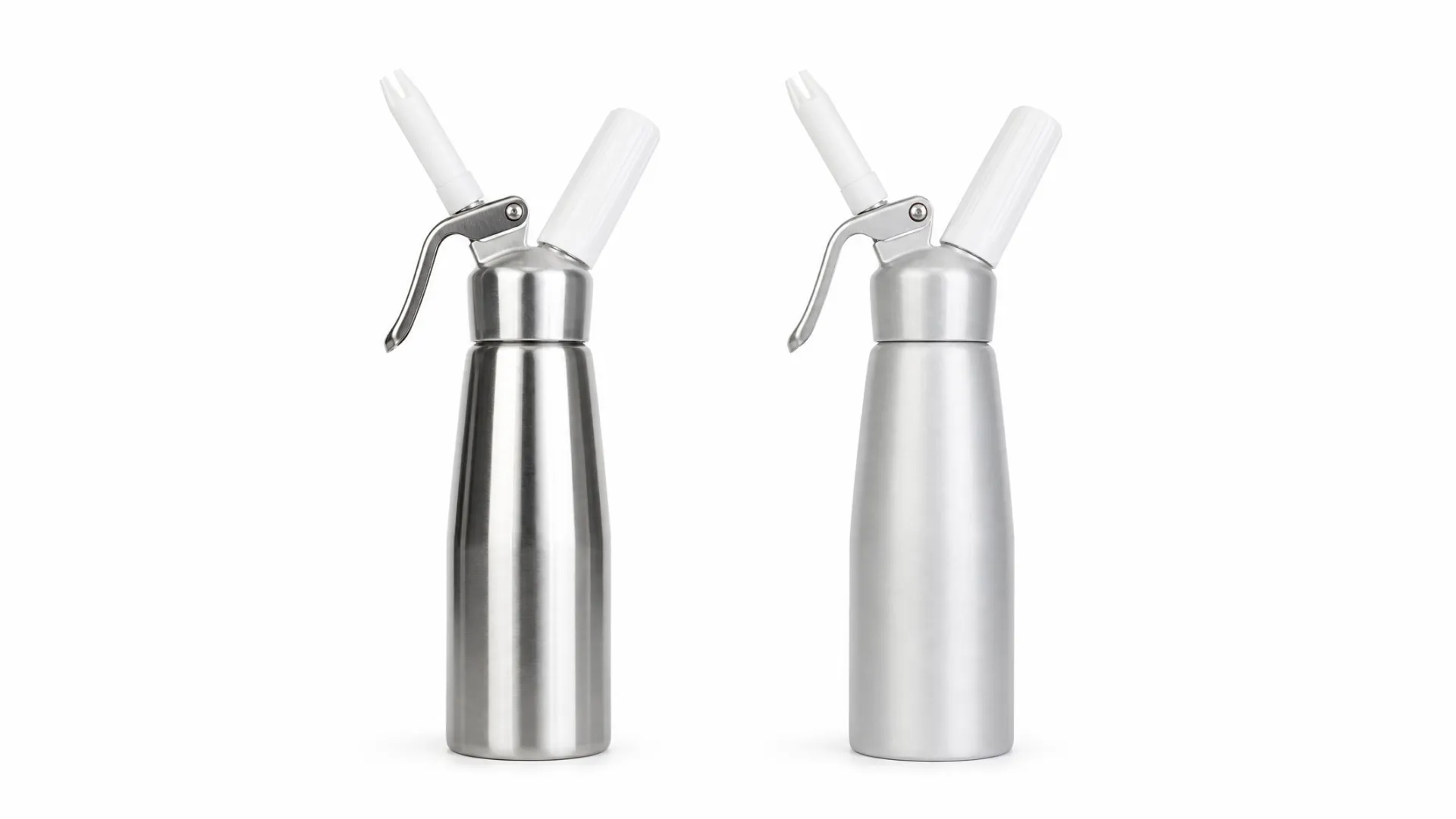 Stainless steel and aluminum whipped cream dispensers compared side by side in a professional kitchen